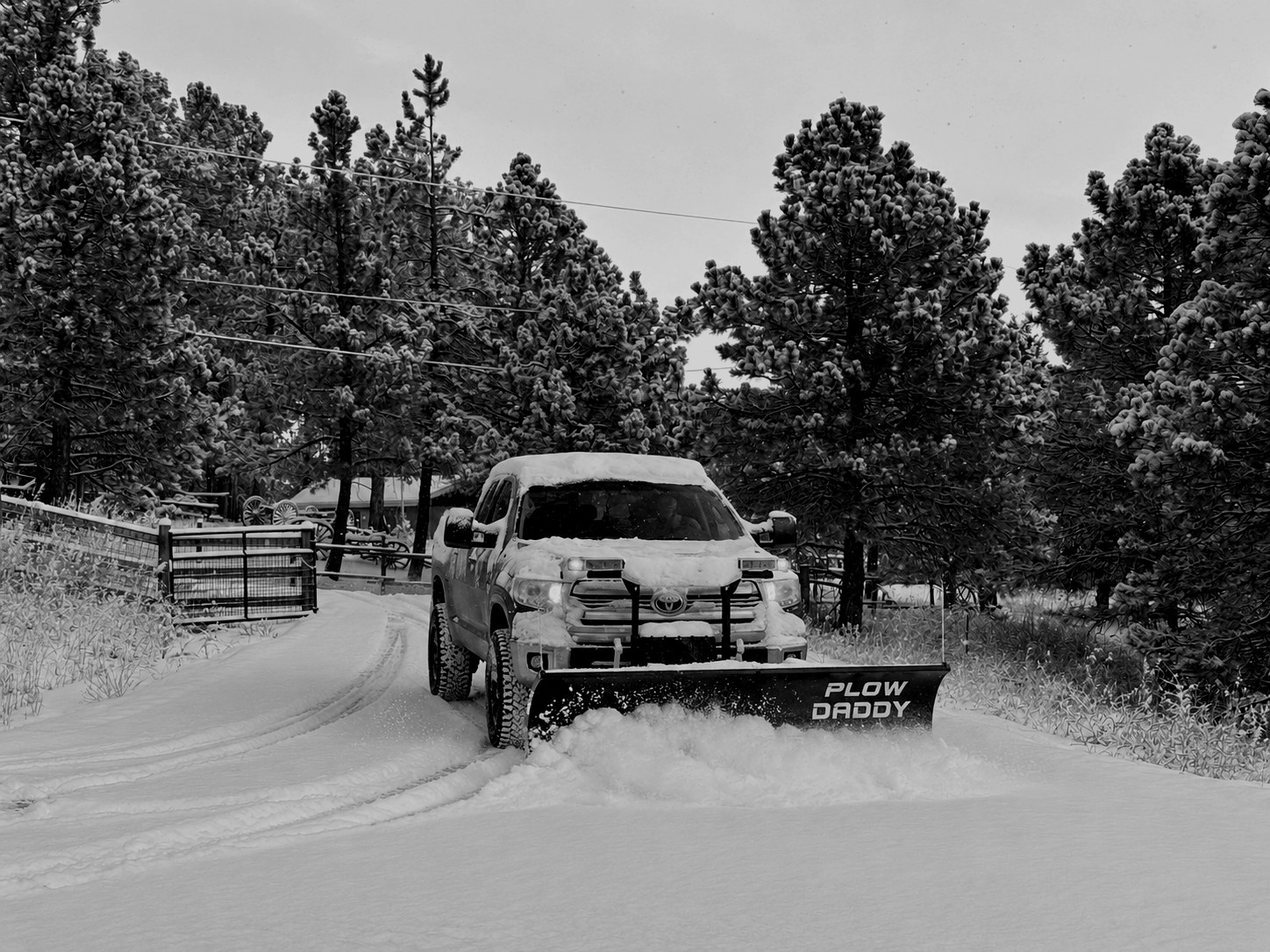 Plow Daddy truck clearing a snowy mountain driveway